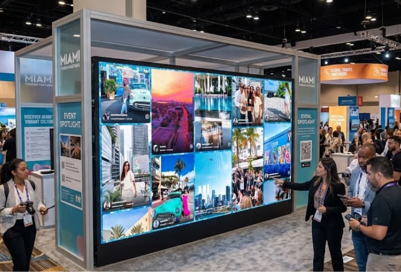 Digital screens at a tourism event showing visitor posts