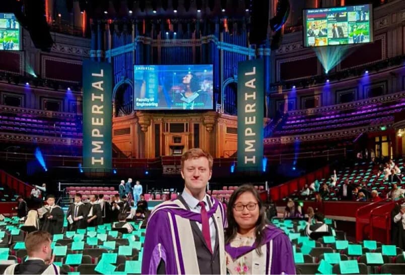 Students engaging with a live event wall at a university graduation ceremony